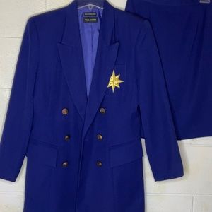 Nice lightly worn two piece Paul Harris purple suit size 6 with a gold star.